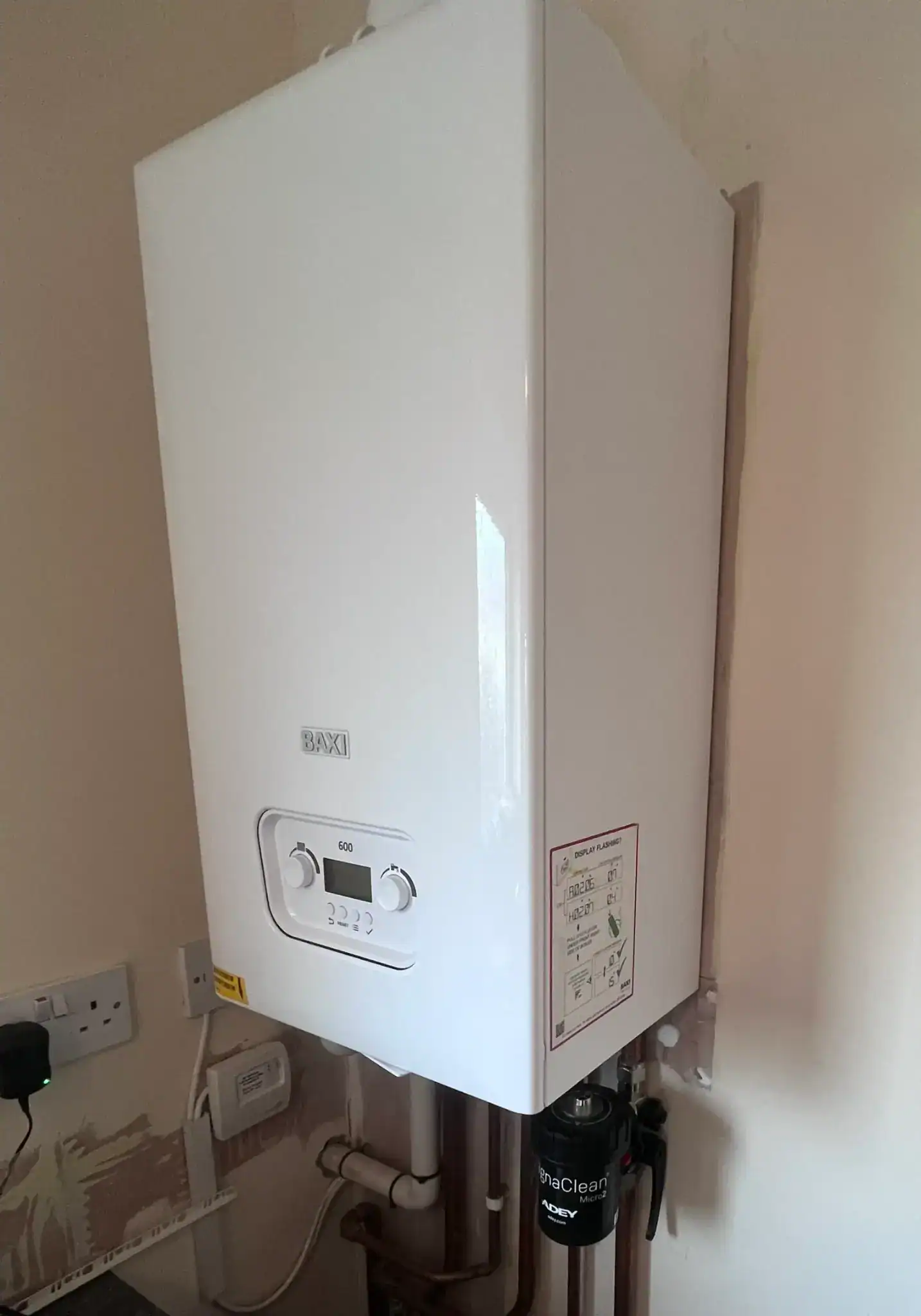 Boiler Supplier King's Lynn installing a Baxi 600 gas boiler with an ADEY MagnaClean system filter and neat copper pipework.