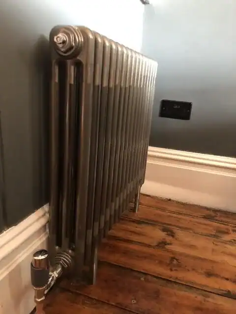 Central Heating Service King's Lynn with a professionally installed anthracite column radiator providing efficient and stylish home heating.