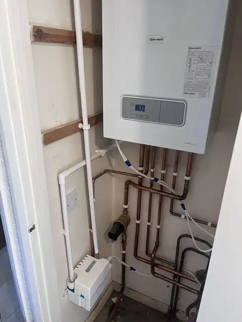Central Heating Service King's Lynn with a professionally installed Glow-worm gas boiler, neat copper pipework, and magnetic system filter for efficient home heating.