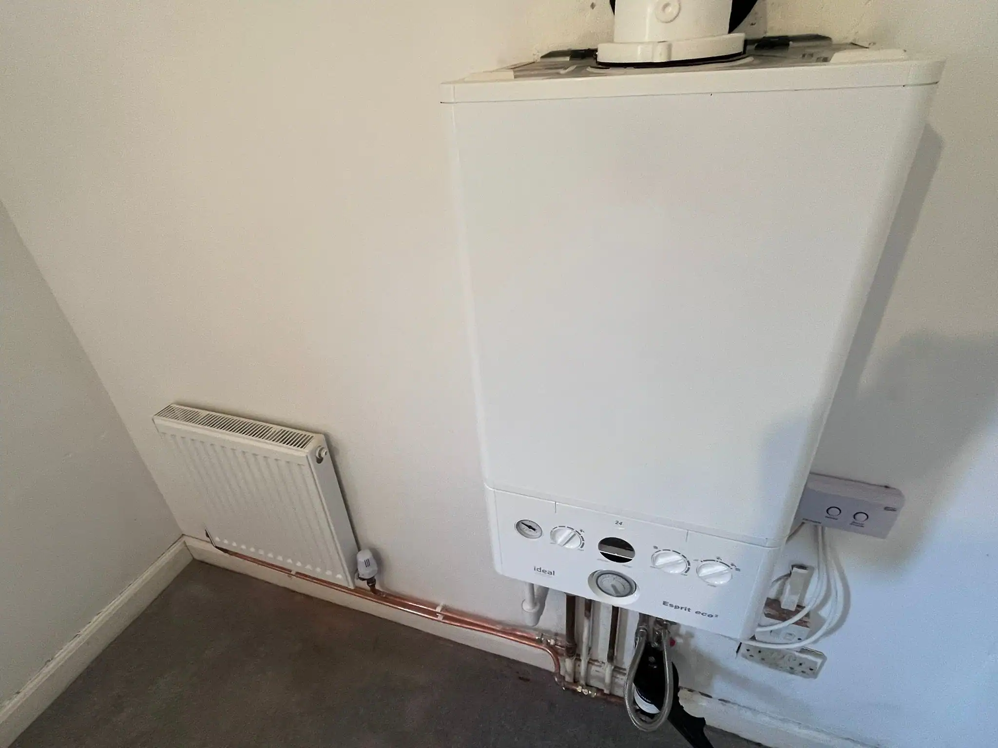 Central Heating Service King's Lynn with a professionally installed Ideal gas boiler and radiator providing efficient, reliable home heating.